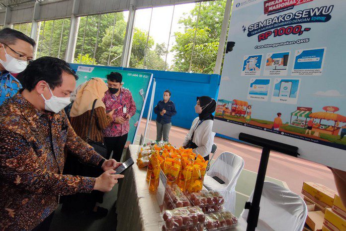 Sosialisasi transaksi QRIS Sosialisasi transaksi QRIS